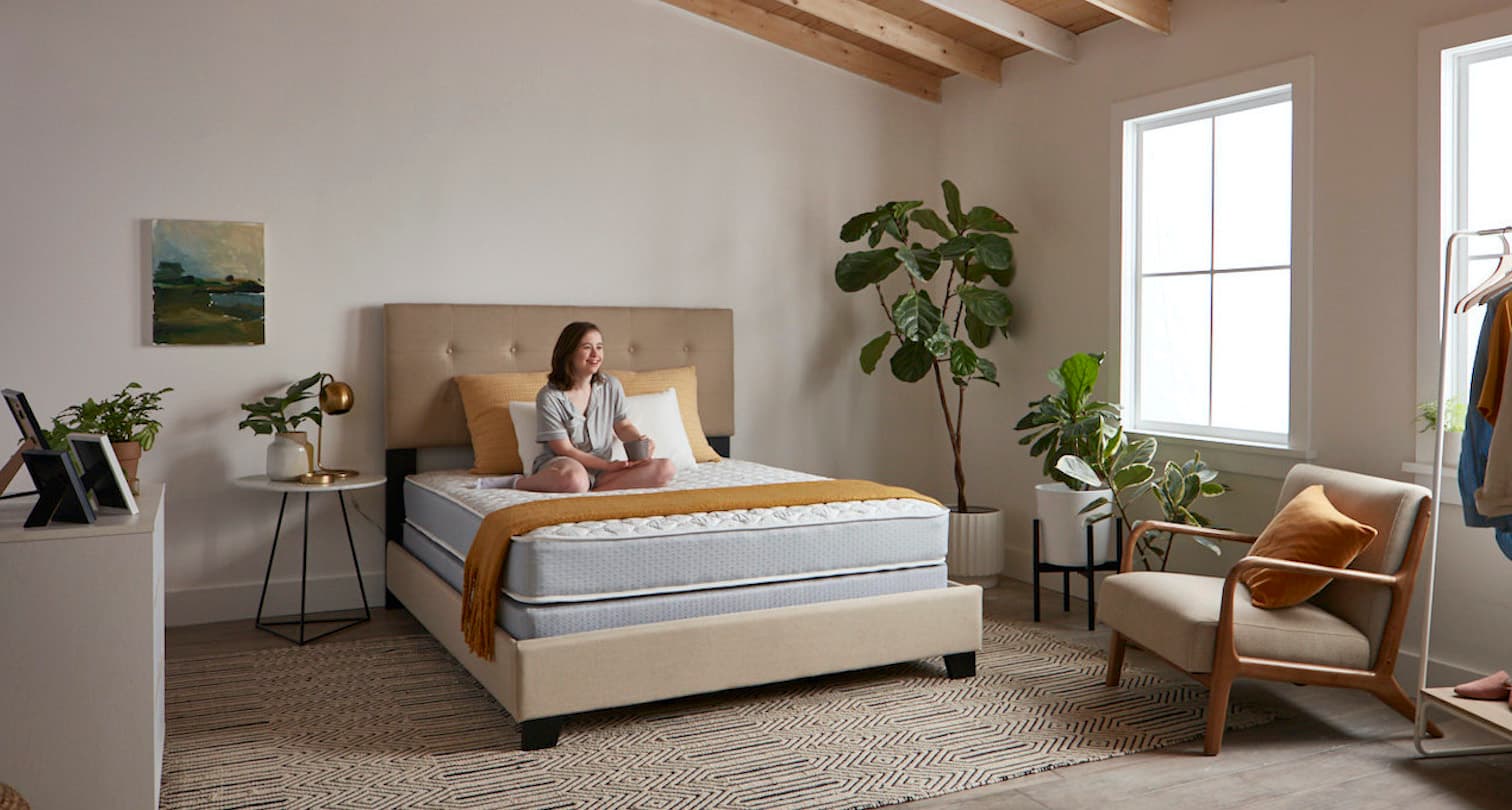 Woman laying in classic Bed